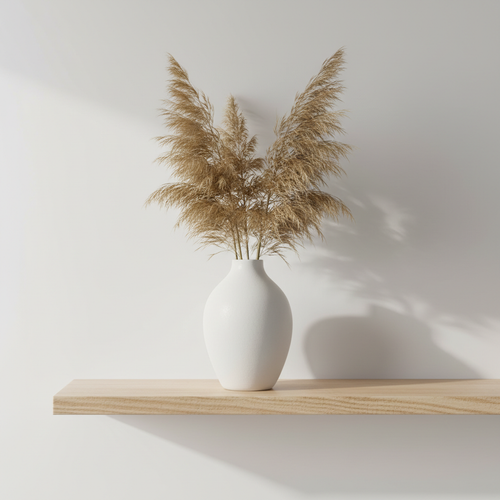 Minimalist Ceramic Vase with dried pampas grass on a wooden shelf
