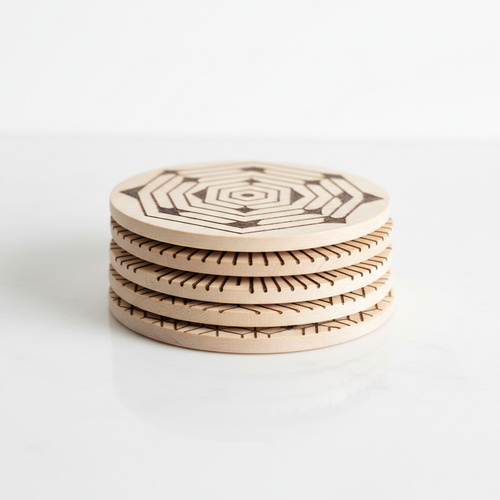 Set of 4 handcrafted wooden coasters with geometric burned patterns